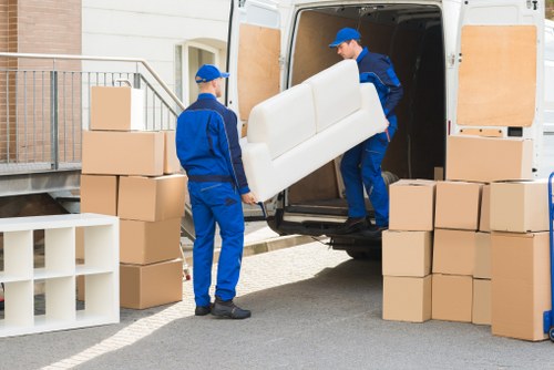 Family home moving preparation with labelled boxes and furniture protection in Streatham