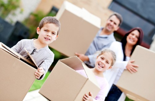Careful furniture moving through a Streatham property with limited access
