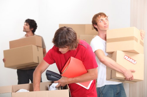 Careful loading of household items into a removals van during a Streatham move