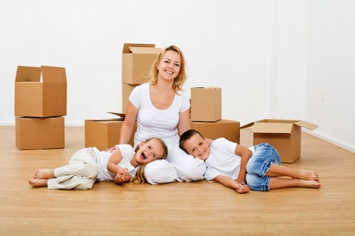 Packed boxes and furniture prepared for a home move in a Streatham property
