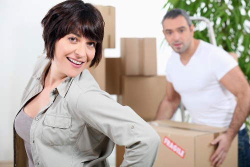 Local removals crew handling apartment furniture in Streatham