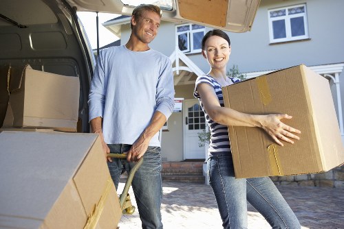 A removal van handling residential furniture and boxes in Streatham