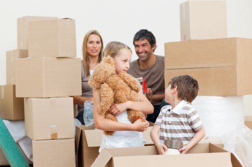 Professional movers navigating stairs and tight access in a Streatham flat move