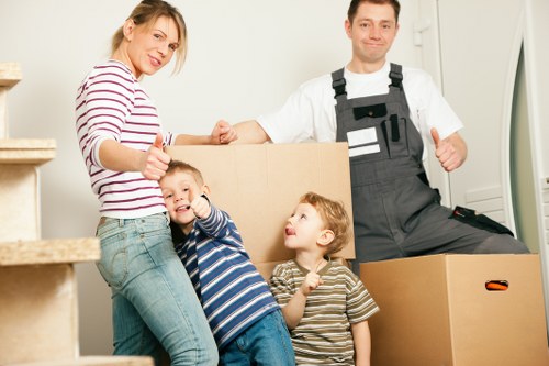 Packed office furniture and labelled boxes ready for a business move